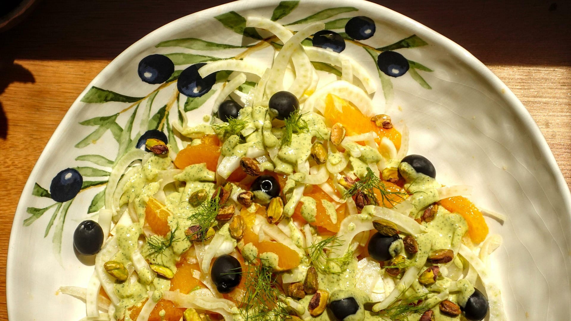 a bowl of Sicilian salad with oranges, fennel and black olives