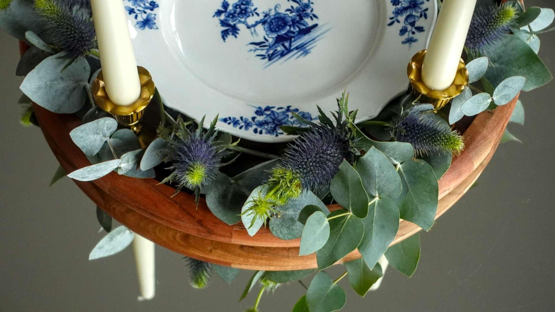An elegant vintage Belgian Tournai porcelain plate arranged on a table for a slow reading ritual.