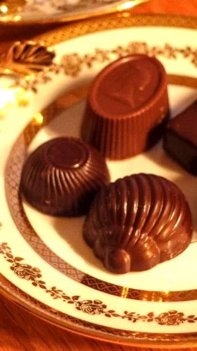 A selection of hand-crafted Belgian chocolate pralines, showing the fine detail of traditional Brussels confectionery.