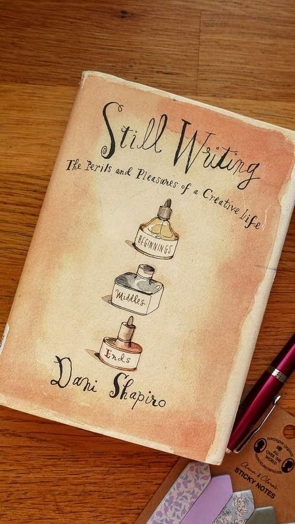 A close-up shot of the book cover for 'Still Writing: The Perils and Pleasures of a Creative Life' by Dani Shapiro.