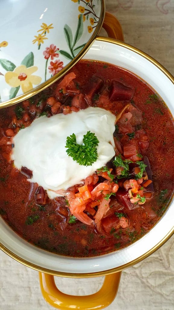 Garnet-colored beet and barley soup in a rustic bowl