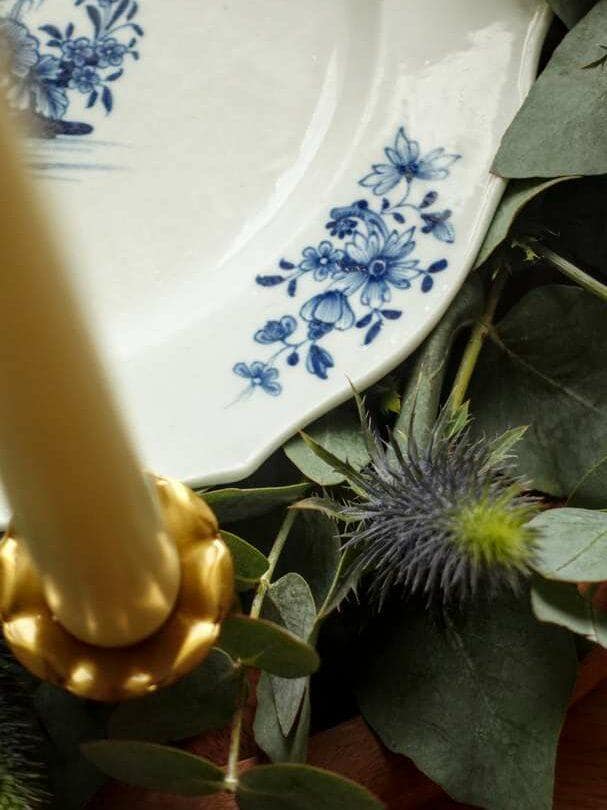 Close-up detail of traditional blue patterns on authentic Tournai porcelain from Belgium.